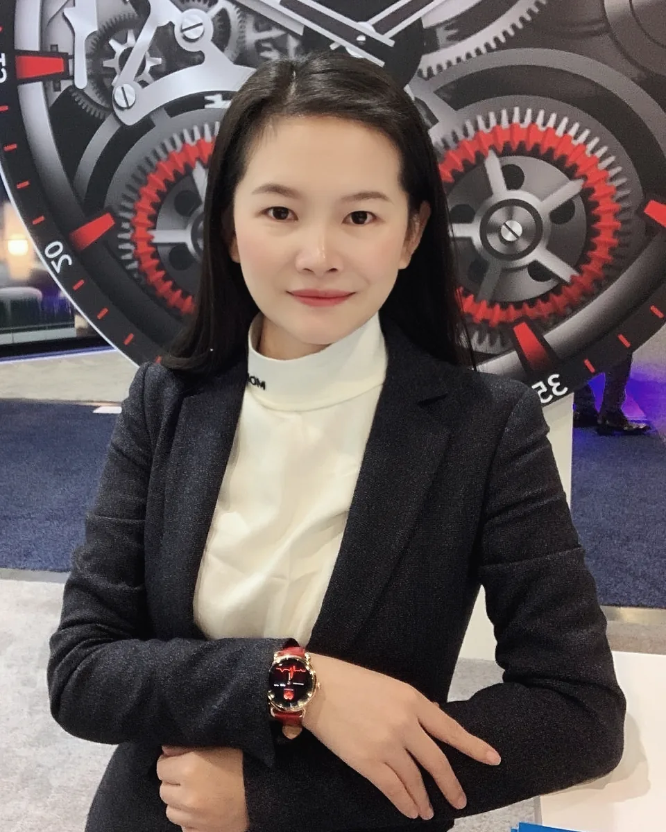 Cherry Liu, founder of AmByte Tech, wearing a smartwatch at an industry exhibition