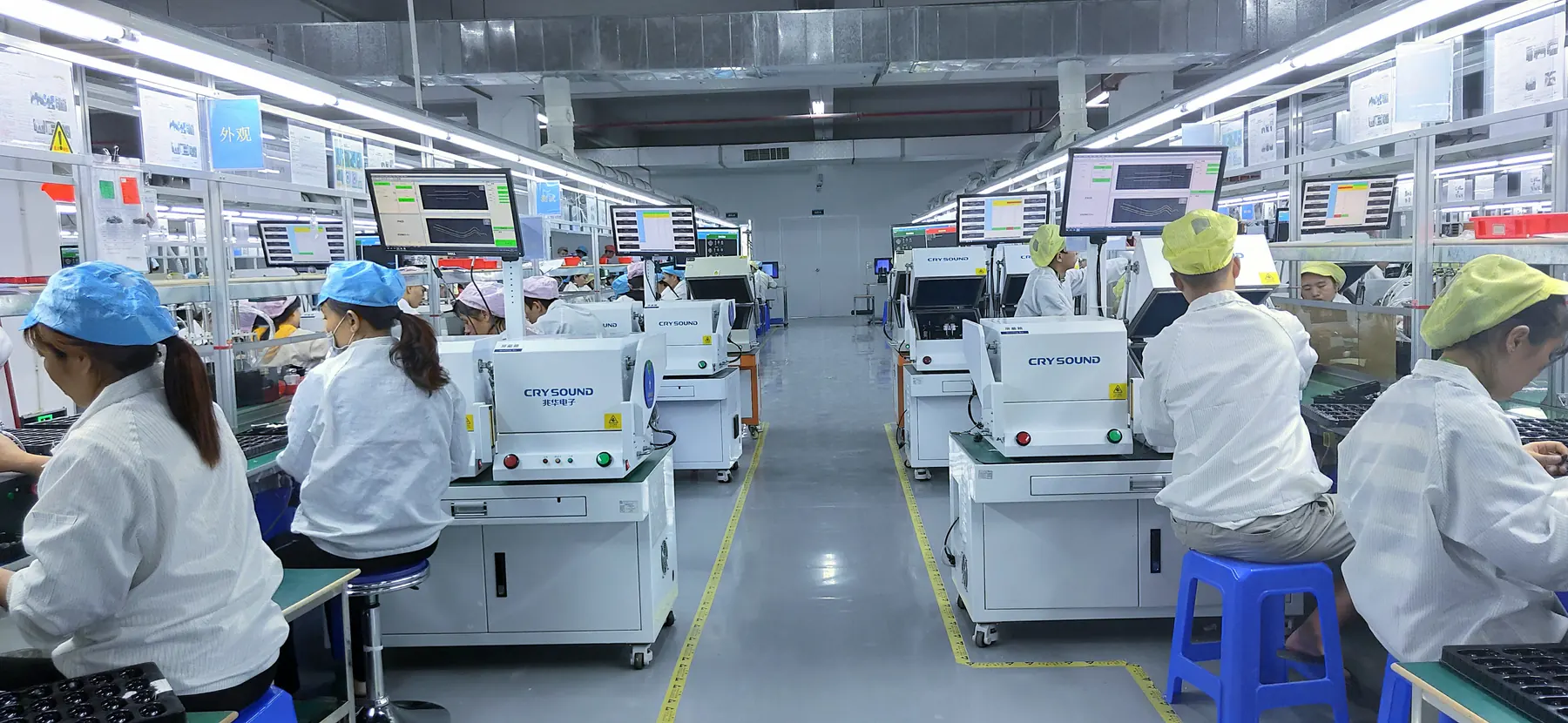 Smartwatch assembly line with operators at workstations